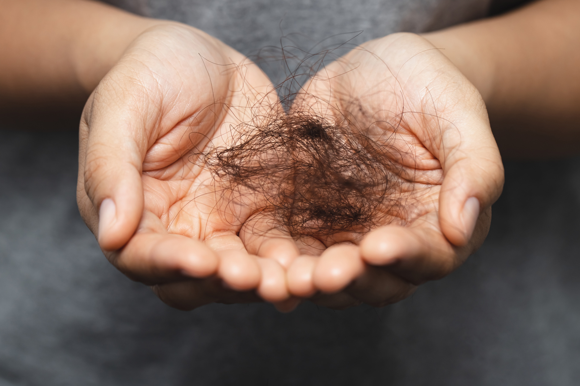Woman Holding Fallen Hair